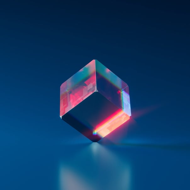 A transparent cube balanced on one ot its corners